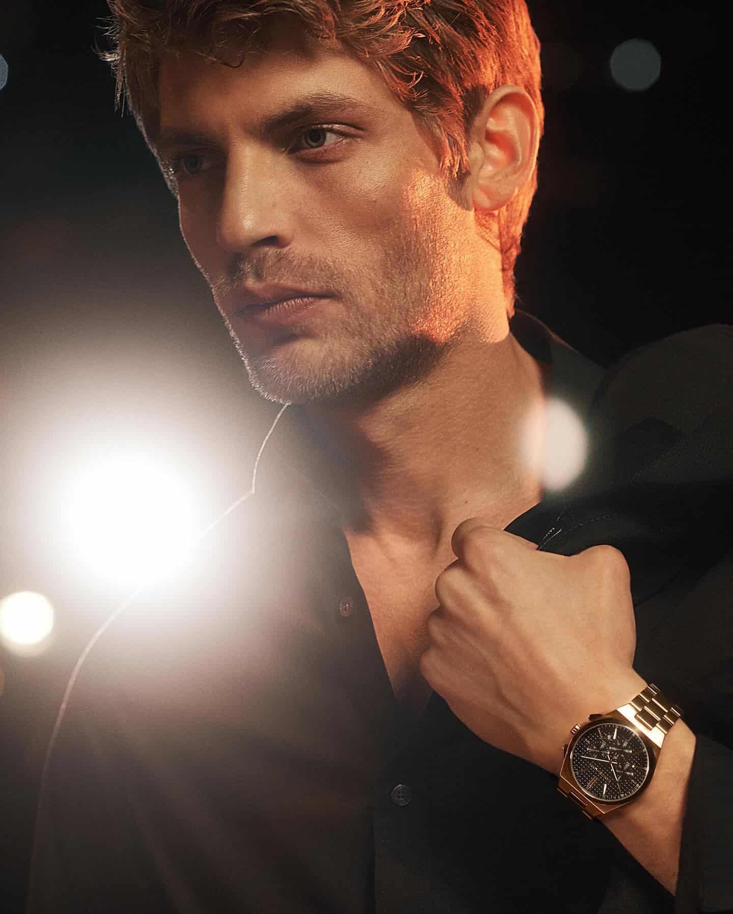 man wearing a chronograph watch by michael kors