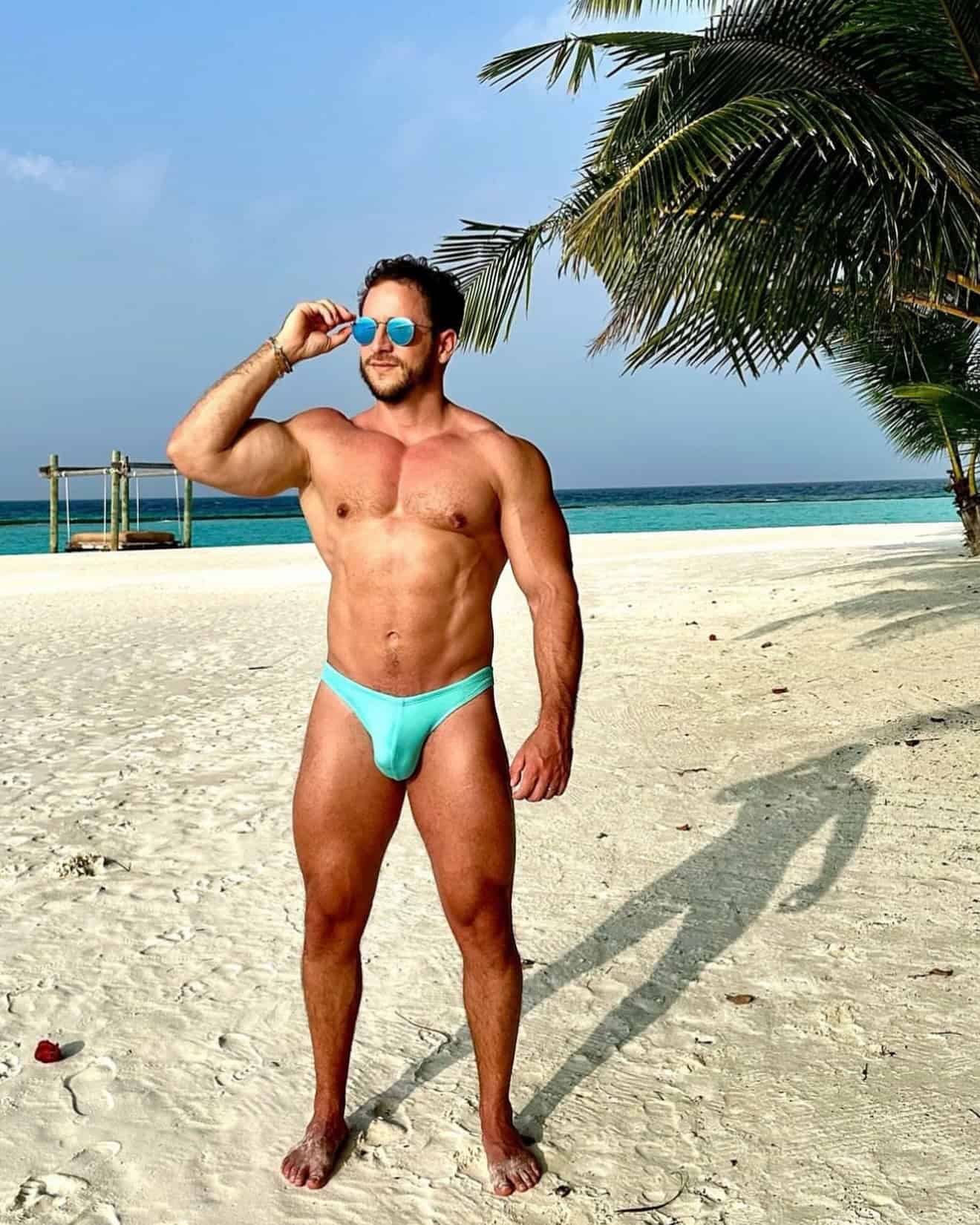 man wearing a cyan bikini underwear